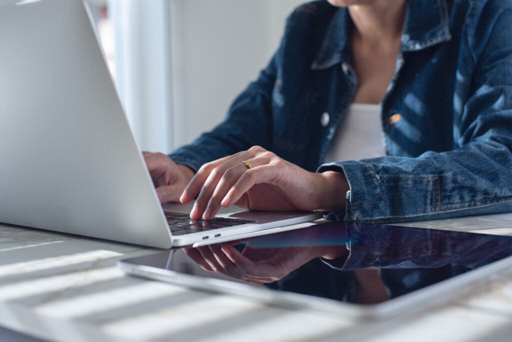 Female investor submitting bids to iFinder
