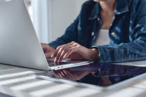 Female investor submitting bids to iFinder