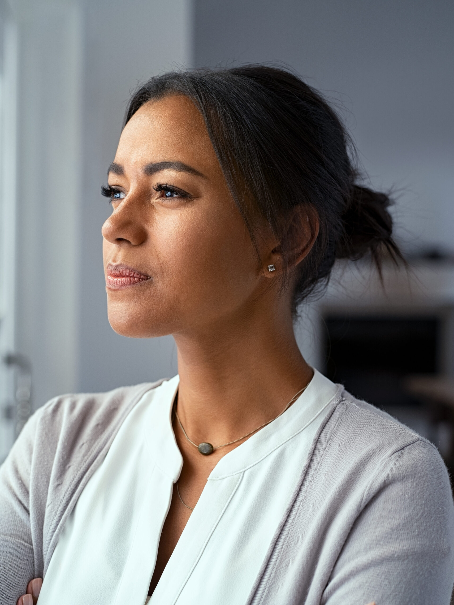 woman looking worried about home sitting on market and needing to sell it