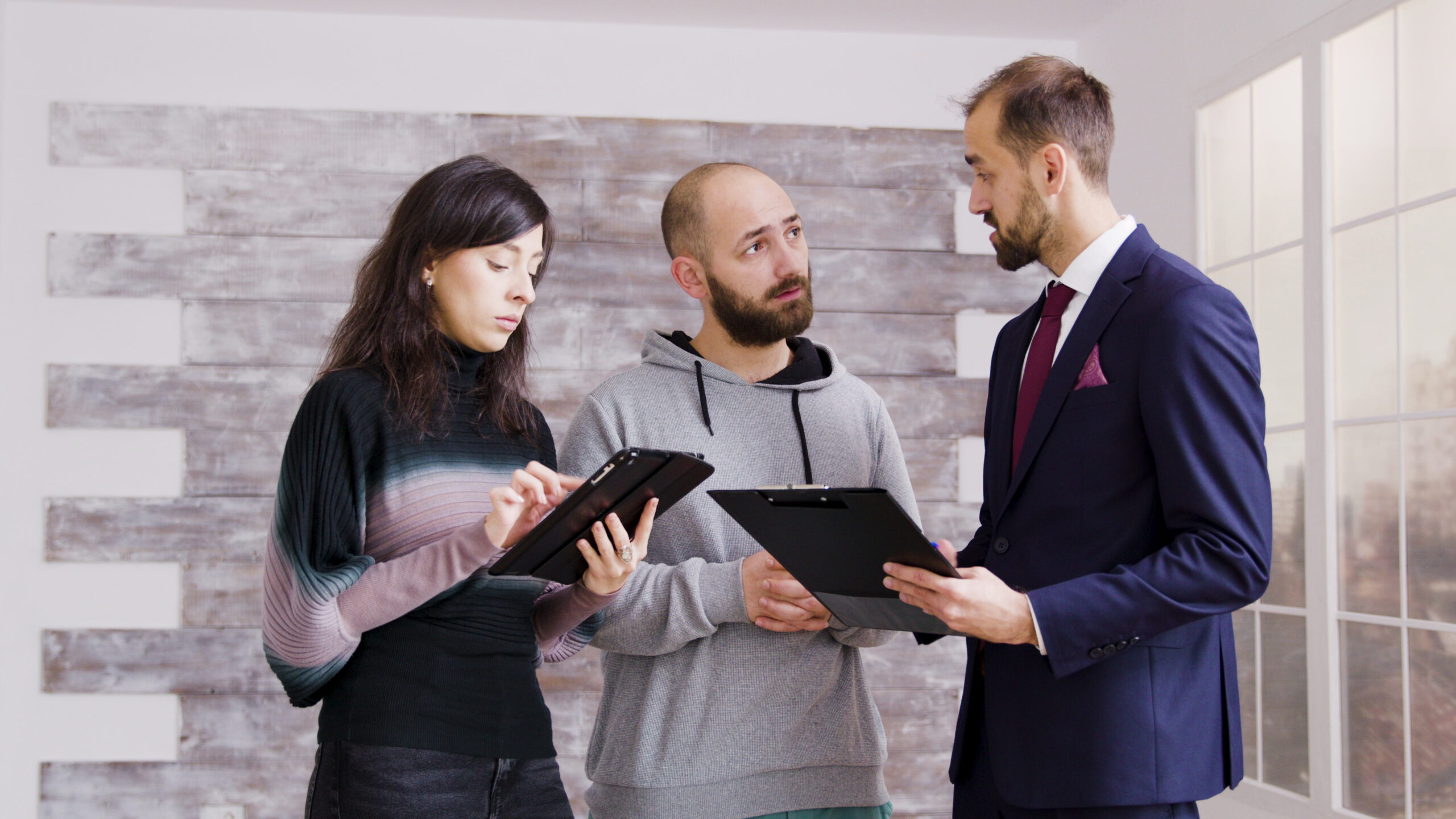 real estate clients want control real estate agent in business suit talking about selling a home with clients